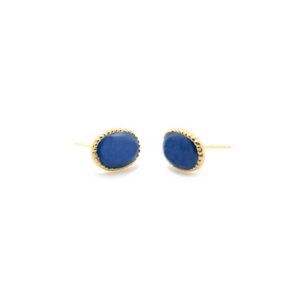 Boucles d'oreilles dorées en forme de puce incrustées d' une perle bleu